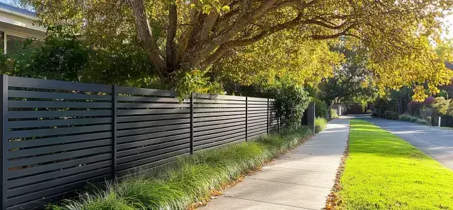 Stylish and Modern looking Slat Aluminium Fence beside of a sidewalk in Frankston.